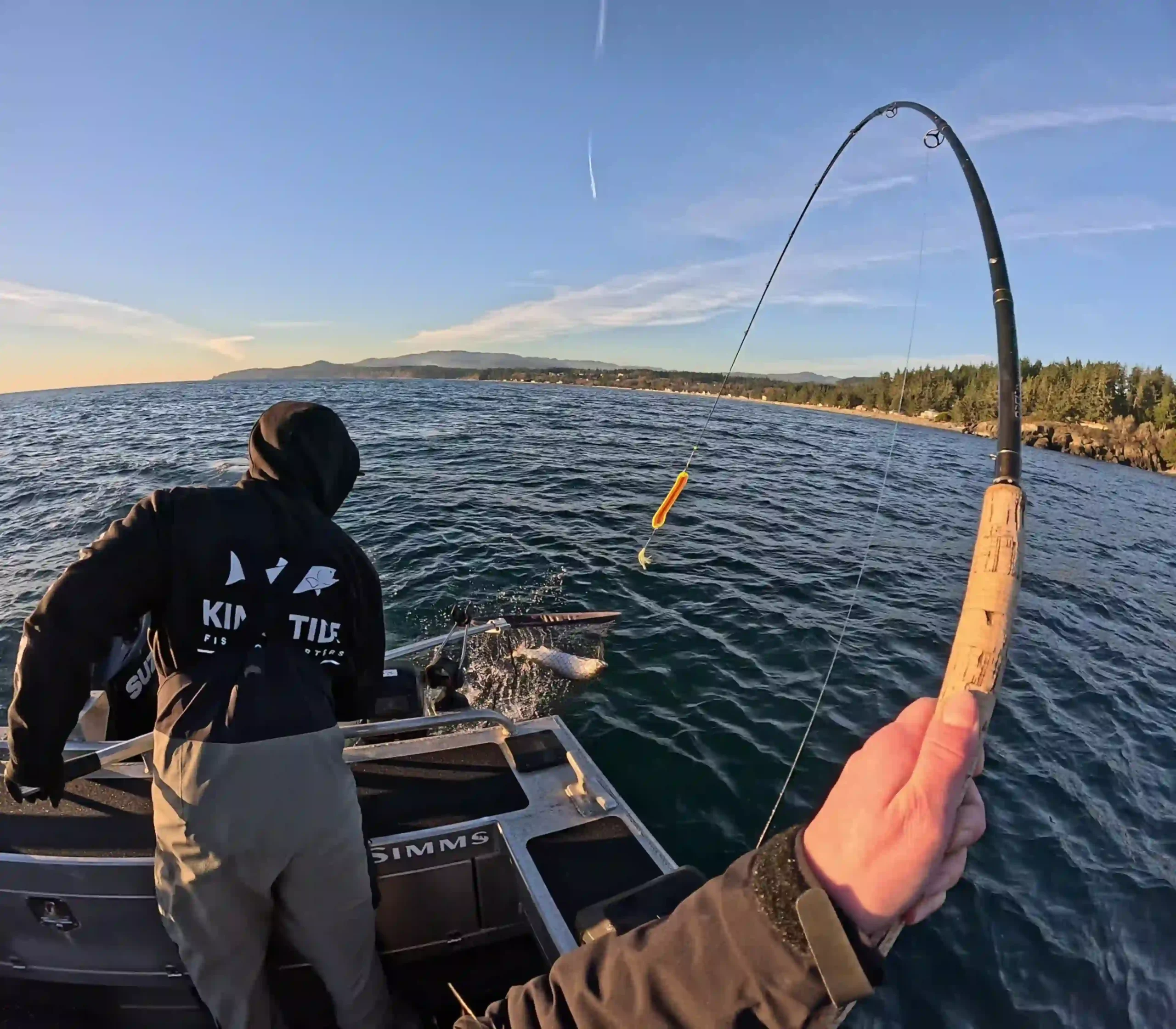 Guide landing a fish